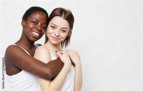 Shot Of Happy Interracial Homosexual Couple Hugging African American