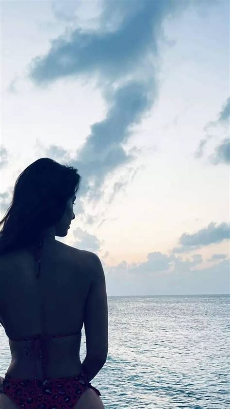 disha patani showing her toned physique in a pink bikini will entice you to visit the beach