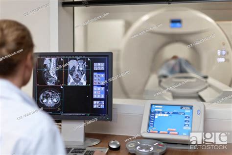 Doctor Operating Ct Scanner In Hospital Stock Photo Picture And