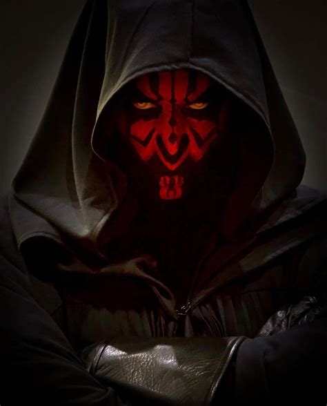 A Man In A Hooded Jacket With Red Glowing Eyes And A Hoodie Over His Face