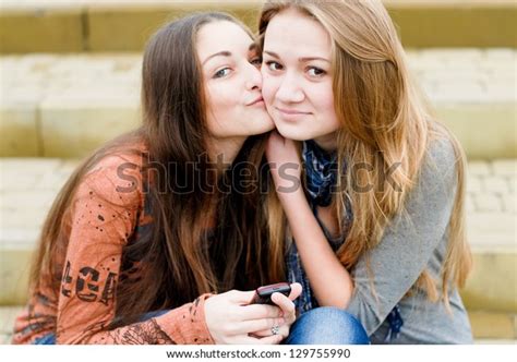 Teenage Girl Comforting Her Friend Reading Stock Photo 129755990
