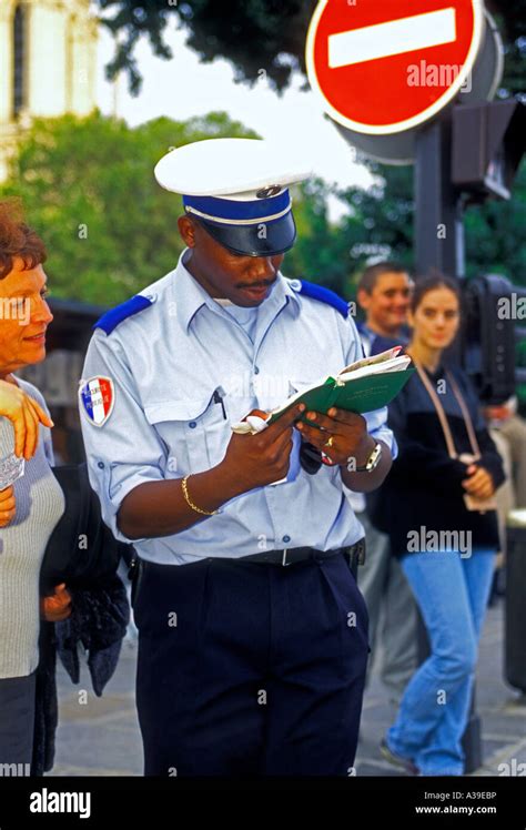 french policeman policeman giving directions to tourist tourist city of paris paris ile de