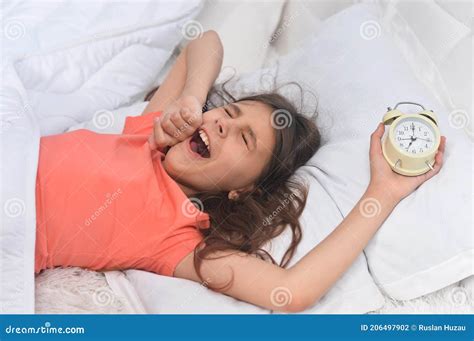 Cute Little Girl Waking Up In Bed Stock Photo Image Of Girlhood