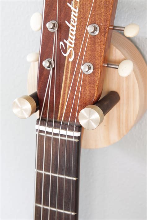 A mounting block is a piece of wood, typically sold with guitar wall brackets; Hyla Handcrafted Guitar Hanger — Hudson Valley Hard Goods