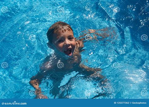 Cute Boy Having Fun In Swimming Pool Stock Photo Image Of Small