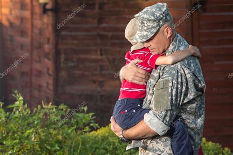 Military Man Father Hugs Son Stock Photo By ©peppersmint 73240653