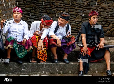 A Group Of Young Balinese Men At A Hindu Festival Tirta Empul Water