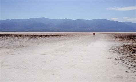Sole Person In The Distance Walking On The Valley Of Badwater Basin