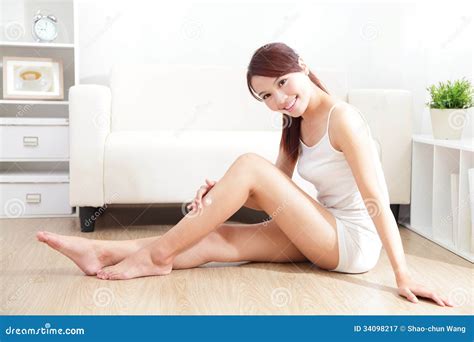 pretty woman applying cream on her attractive legs stock image image of female body 34098217