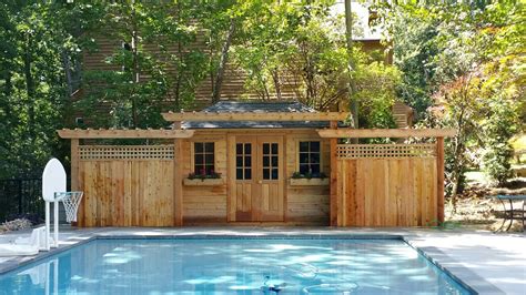 This Summerwood Sonoma Pool House Is Surrounded By A Fence And