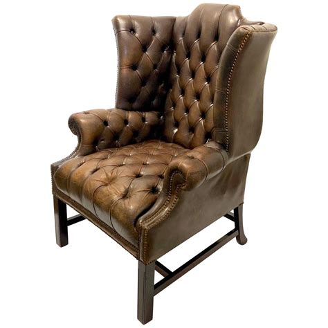 Upholstered, winged chairs will give your dining room an air of elegance. Antique Chesterfield Tufted Distressed Leather Tall ...