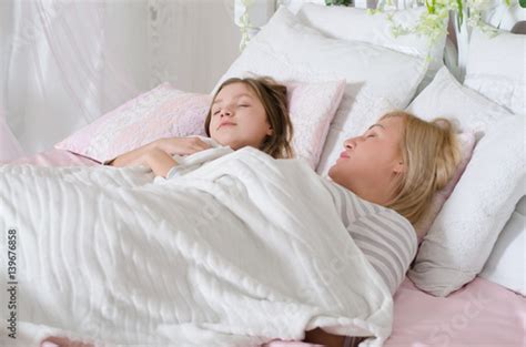 Mom With Her Teen Daughter Relaxing In Bed Positive Feelings Good