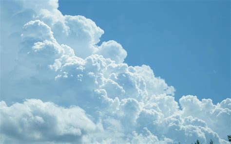 Download The Magical Beauty Of Heavenly Clouds Wallpaper