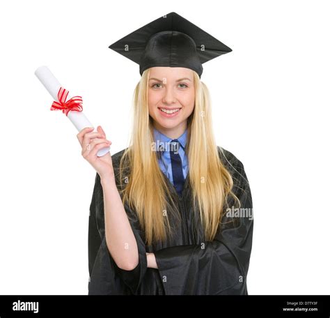 Happy Young Woman In Graduation Gown Showing Diploma Stock Photo Alamy