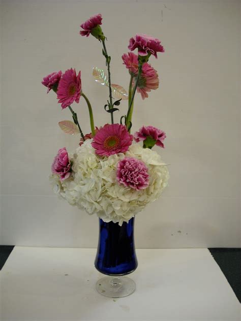 Sevens Heaven Arrangement With White Hydrangeas Ink Gerbera Daisies