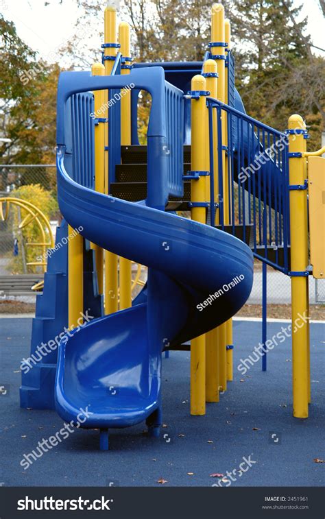 Blue And Yellow Slide On Blue Playground Stock Photo 2451961 Shutterstock