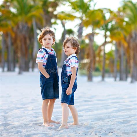 Two Little Kids Boys Having Fun On Tropical Beach Happy Best Friends