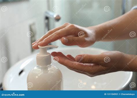 Woman Applying Liquid Soap On Hand In Bathroom Stock Image Image Of
