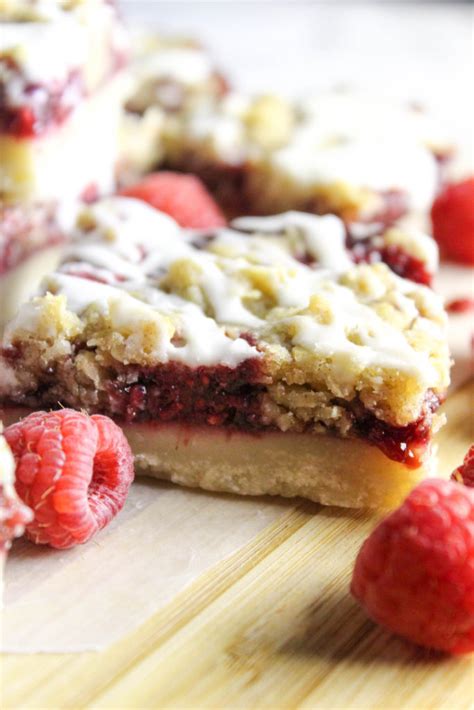 These raspberry bars are on a shortbread crust with an almond crumble topping. Raspberry Streusel Shortbread Bars | Baking You Happier