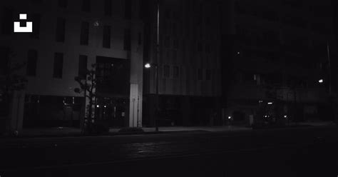 Grayscale Photo Of City Building During Night Time Photo Free Road
