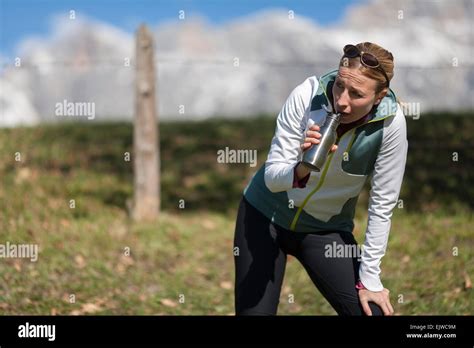 Austria Salzburger Land Maria Alm Woman Drinking From Bottle Stock