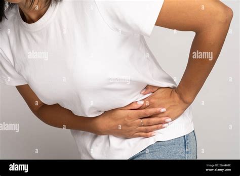 Sick Woman Touching Left Side Suffer From Acute Abdominal Pain In
