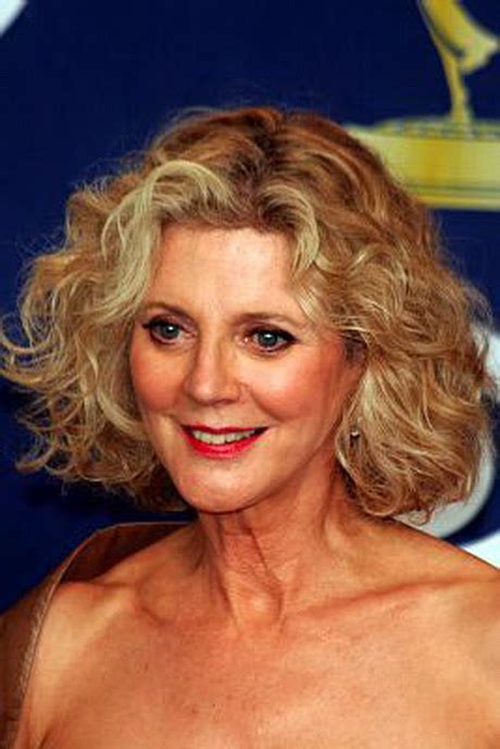 The color blend complements her lovely blue eyes amazingly. Curly hairstyles for older women