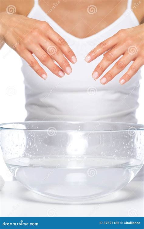 Closeup On Young Woman Washing Hands In Glass Bowl With Water Stock