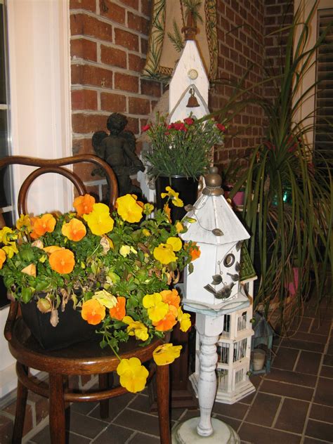 Front Porch Decorated With Spring Flowers And Birdhouses Porch