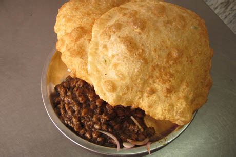 Chole bhature is a combination of chana masala (spicy white chickpeas) and bhatura, a fried bread made from maida flour. chole-bhature-recipe-from-india | Foodists