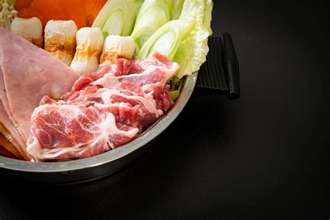 Sukiyaki Or Shabu Hot Pot Soup With Raw Meat And Vegetables Japanese