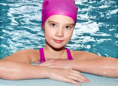 Portrait Of Cute Smiling Little Girl Child Swimmer In Pink Swimming