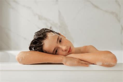 Premium Photo Teenager Takes A Bubble Bath