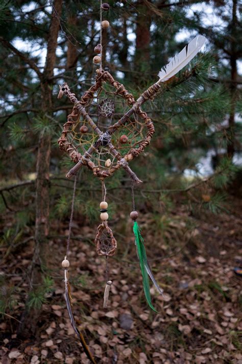 A Wind Chime Hanging From A Tree In The Woods