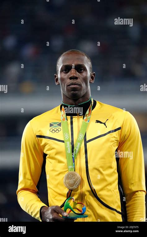 jamaica s usain bolt with his gold medal on the podium of the 100m men in olympic stadium rio