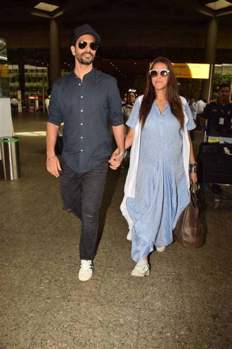 Pregnant Neha Dhupia And Angad Bedi Hand In Hand At The Airport See Pics