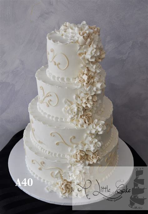 Draping fondant adds to the romantic imagery of this cake. A40 - Elegant Gold And White Floral Buttercream Wedding Cake