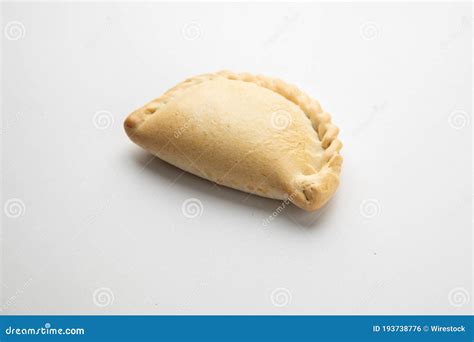 Closeup Shot Of An Empanada Isolated On A White Background Stock Photo