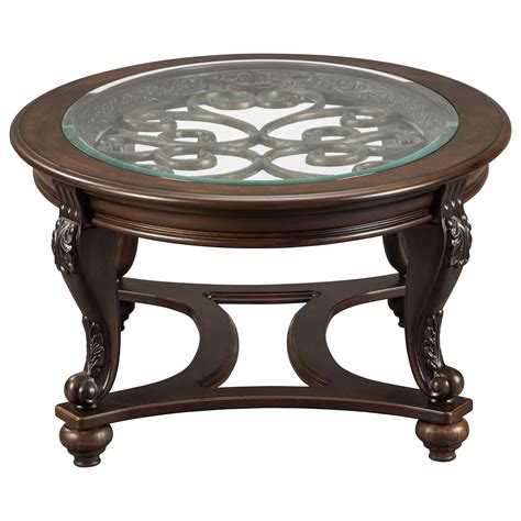 Their fanciful pattern is echoed in the carvings and curves of the richly stained legs and stretchers. Signature Design by Ashley Norcastle T499-0 Oval Cocktail ...
