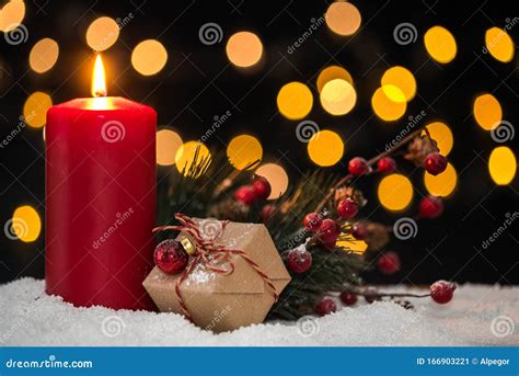 Chistmas Candle On Snow With Lights In Background Stock Image Image