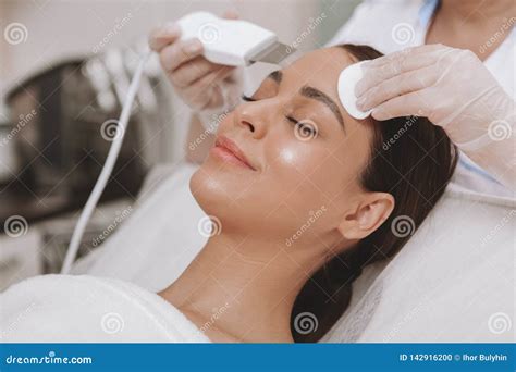 Lovely Young Woman Visiting Cosmetologist At Beauty Clinic Stock Photo