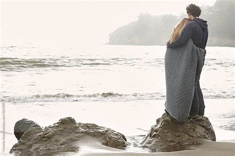 Couple Embracing On Rock At Beach In California By Trinette Reed