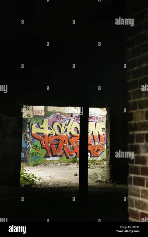 Graffiti And Vandalism In Abandoned Derelict Industrial Building Stock Photo Alamy