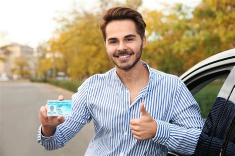 Young Man Holding Driving License Stock Photo Image Of Driving