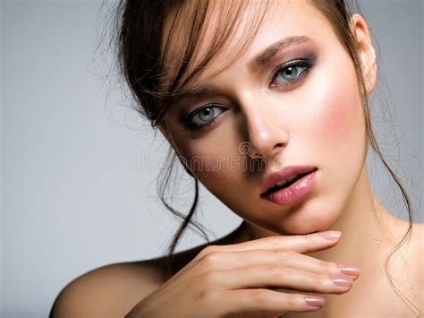 Closeup Face Of Young Beautiful Woman With A Healthy Clean Skin Pretty