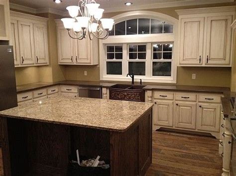 Check it out for yourself! White molding and distressed cabinets with wood floors ...