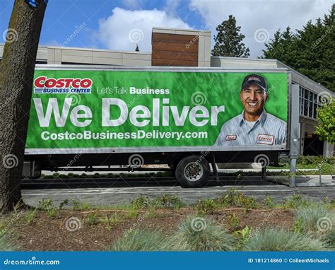 Street View Of A Costco Business Delivery Truck Parked On The Side Of
