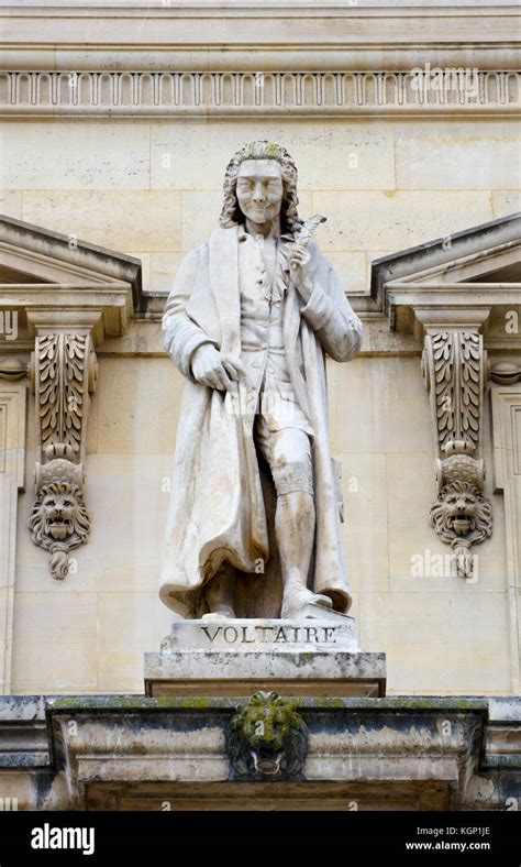 Paris France Palais Du Louvre Statue In The Cour Napoleon Voltaire