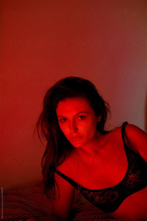 Portrait Of An Attractive Girl In Underwear Red Light In The Room