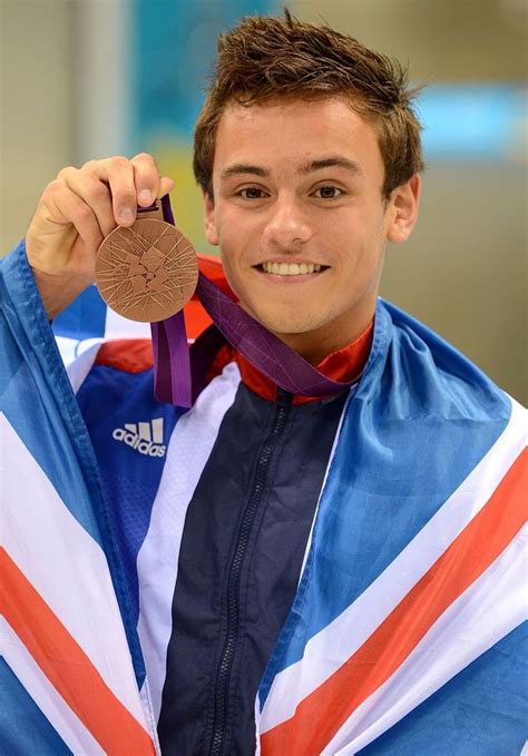 Great britain's gold medal winning diver, tom daley, unveils the cardigan he has been knitting while at the olympic summer games in tokyo. Tom Daley celebrates his bronze medal. - London 2012 ...